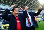 Chefen. Vincent Tan (tv)og manager Malky Mackay jublede sammen i april, da oprykningen til Premier League var en kendsgerning. 