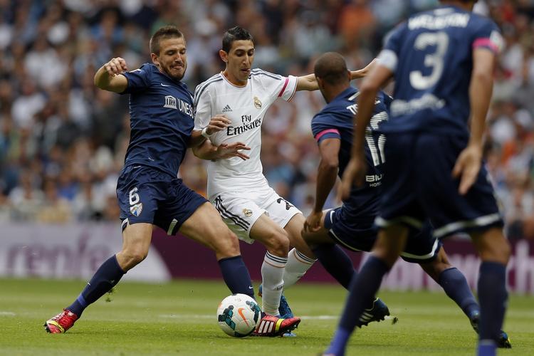 2-0. Angel Di Maria (midt) scorede første mål for Real Madrid i kampen mod Malaga. 