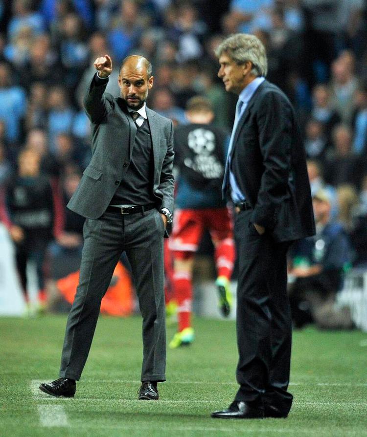 modedyr. Pep Guardiola i moderne jakkesæt, mens Jürgen Klopp (nedenfor) er i vild gul dunjakke. 