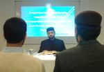 Fortolkning. Imam Hassan Mohi-ud-Din Qadri er søn af overhovedet for Minhaj ul-Quran-organisationen, som findes i 90 lande. Hassan Mohi-ud-Din Qadri har en ph.d. i islamisk ret fra The Arab League University in Cairo. 