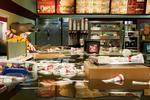 Oversvømmelse. Superflex's mest berømte video viser en McDonald's, der langsomt fyldes af vand. Branding kommer faktisk af at 'brænde', og Superflex er en slags brandmænd, der sprøjter vand. 'Flooded McDonald's' (videostill) 2008. 