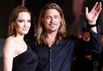 Stjernekram. Brad Pitt med sin hustru Angelina Jolie vinker til fans ved premieren på filmen 'World War Z' i Tokyo i juli. 