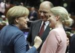 KVINDER. Angela Merkel er ikke vild med kvindekvoter i virksomhedsbestyrelser, men hun er presset til det af sin regeringspartner. 
