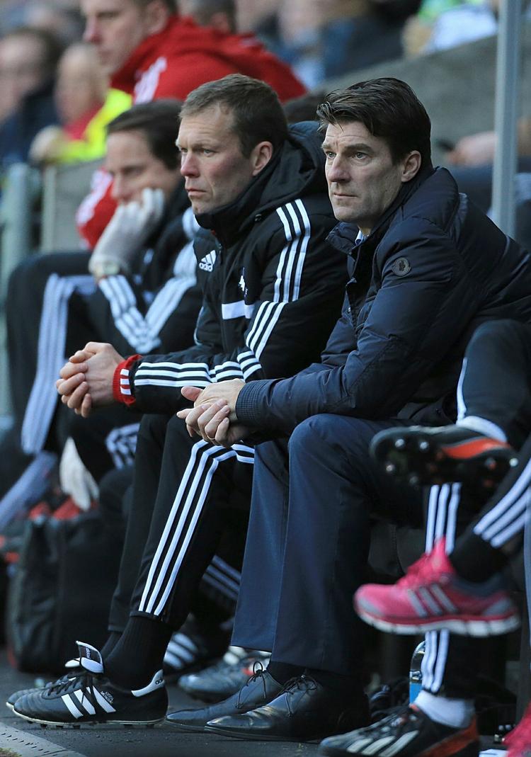 Nederlag. Michael Laudrup og assistenten Morten Wieghorst (tv) så søndag deres Swansea-hold tabe 3-1 til Tottenham. 