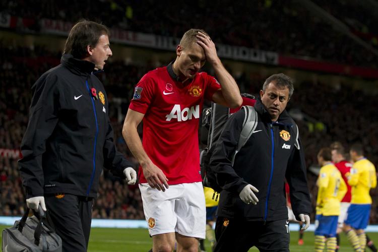 kriger. Nemanja Vidic (midt) er kendt for at give alt i kampene for Manchester United. 