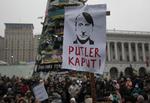 Putler. Demonstranter i Kiev er ikke i tvivl om, hvad de synes om Putin, som det fremgår fra denne demonstration i søndags. 