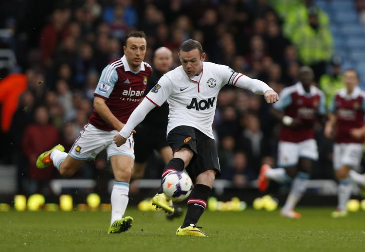 Hovedrolle. Manchester Uniteds Wayne Rooney (th.) spillede en afgørende rolle mod West Ham. Syv minutter inde i kampen scorede han et af sæsonens bedste mål. 