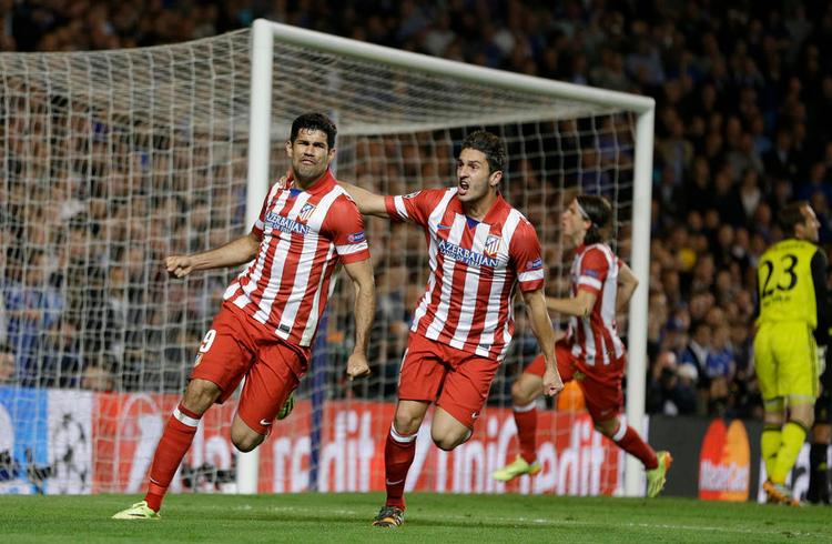 pletskud. Diego Costa og Koke fejrer førstnævntes scoring til 1-2 på straffespark. - Foto: Kirsty Wigglesworth/AP 