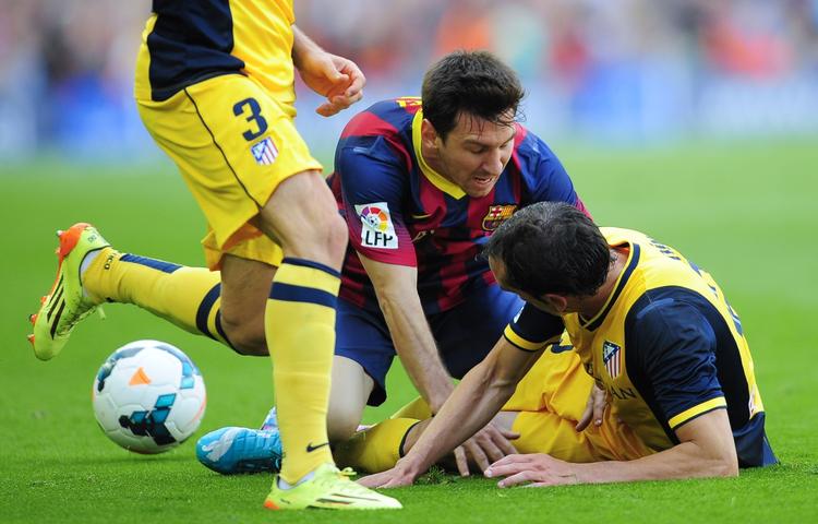 ændringer. Attletico sikrede sig mesterskabet med uafgjort mod Barcelona, hvor Lionel Messi (midt) leverede en pauver indsats. 