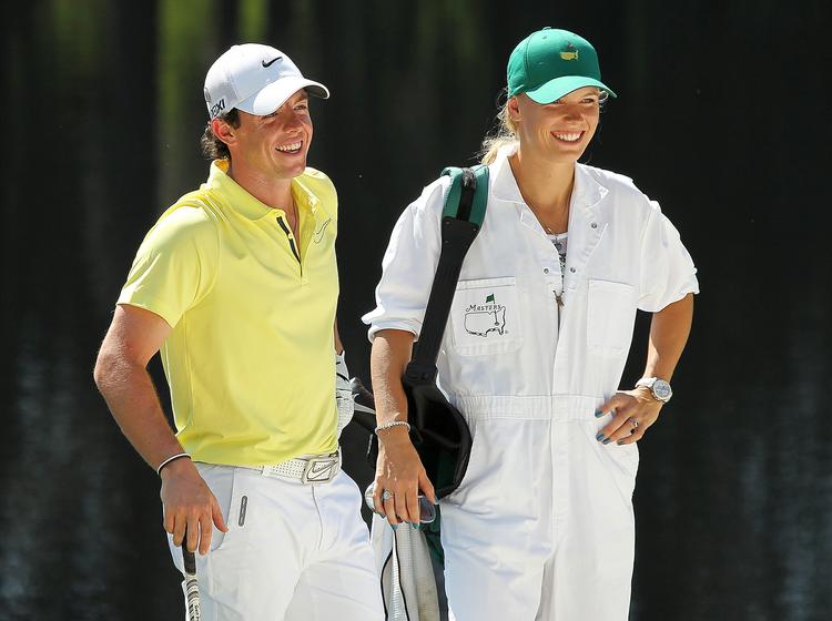 brud. Rory McIlroy og Caroline Wozniacki havde for travlt med at følge hinanden på sportsbanerne, mener kommentatorer. 