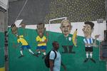 TEGNESERIEHOLD. Selvfølgelig er Politikens forudsigelser kun til tegnebrættet, lige som denne illustration på en væg i Rio de Janeiro. 