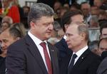 Diplomati. Petro Porosjenko og Vladimir Putin snakkede sammen i går på 70 års-dagen for D-dag. 