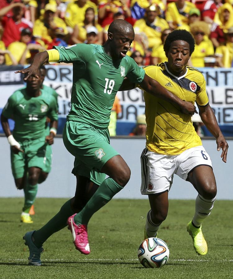 Nøglespiller. Yaya Touré (tv) er anfører for Elfenbenskysten. 