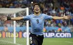 IKON. Luis Suarez er stadig en del af Uruguays VM-trup - i hvert fald i ånden. 