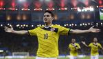 Indkøb. Colombias James Rodriguez fejrer sit åbningsmål mod Uruguay. Nu skifter han til spansk kongeklub. 