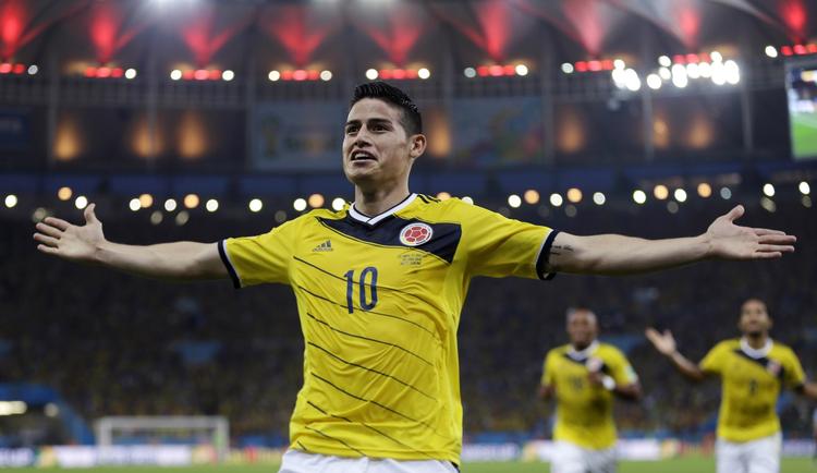 Indkøb. Colombias James Rodriguez fejrer sit åbningsmål mod Uruguay. Nu skifter han til spansk kongeklub. 