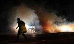 OPTØJER. Ferguson-beboer flygter fra tåregasskyerne under urolighederne. 