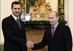 VENNER. IS truer angivelig med at styrte Ruslands præsident og befri Tjetjenien som straf for Moskvas støtte til Damaskus-regimet. Her ses Putin og Assad sammen i 2006. 