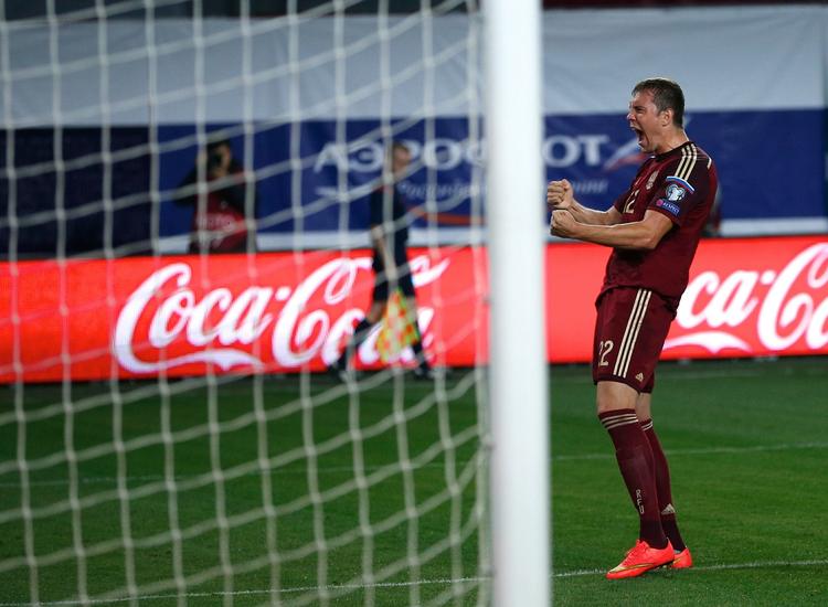 Scoring. Artem Dzyuba ligner en mand, der har scoret et afgørende mål, men det er nu 'kun' en 4-0-scoring mod Lichtenstein, han her jubler over. 