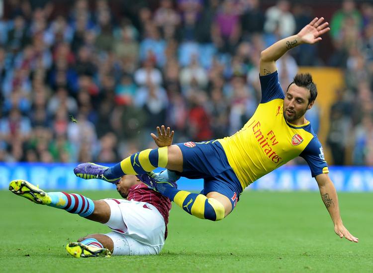 Efter en sløj start på kampen af Arsenal-spillerne, hjalp en tre-minutters kollaps af Aston Villa London-holdet til tre hurtige scoringer. 
