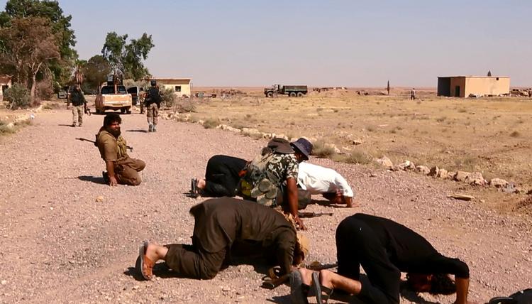 Ekstremister. Her ses IS-soldater tæt på hovedsædet Raqqa. 