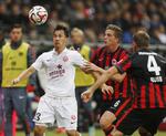 tophold. Shinji Okazaki (tv) kom på scoringstavlen for Mainz, der dog måtte nøjes med et point mod Frankfurt. 