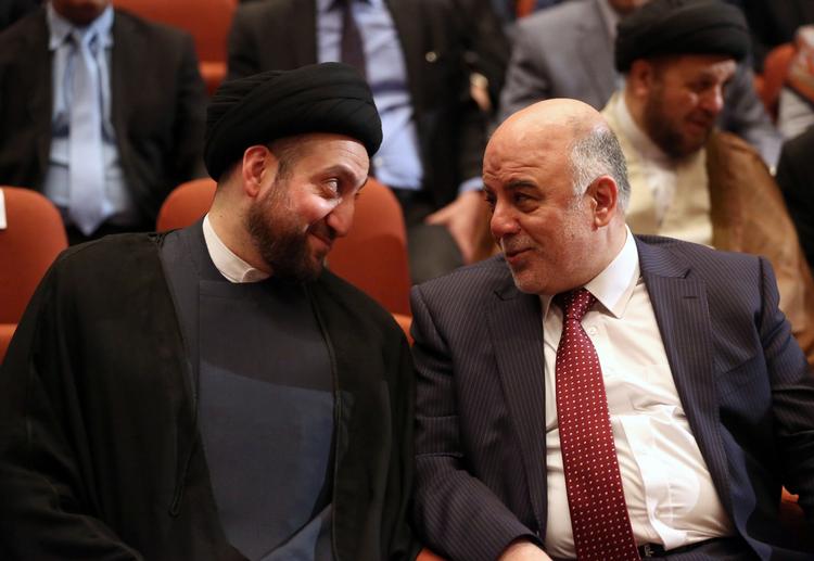 Nyvalgt. Iraks premierminister Haider al-Abadi til højre ses her da regeringen kom på plads i begyndelsen af september. Manden til venstre er Ammar al-Hakim, leder af Islamisk Råd. 