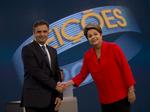 Dilma Rousseff (th.) er de fattige brasilianeres foretrukne kandidat, men udfordreren  Aecio Neves (tv.) henter ind på hende. 