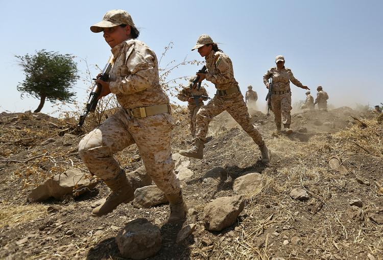 Alliance. Soldater i den kurdiske peshmerga-milist træner i Irak i juli. Nu er soldaterne fra styrken på vej til Syrien for at komme den beljrede by Kobane til undsætning. 