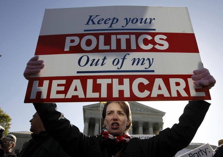Amy Brighton fra Ohio var på gaden tidligere i år i protest mod republikanernes ændringer af Obamacare. Nu ser et kompromis-forslag ud til at komme forbi første store hurdle. 