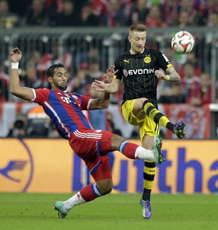 Klubskifte? 25-årige Marco Reus (th) er i gang med sin tredje sæson i Dortmund. Han har spillet 23 landskampe for Tyskland og havde været verdenemster, hvis ikke en skade umiddelbart før VM satte en stopper for hans deltagelse i Brasilien. 