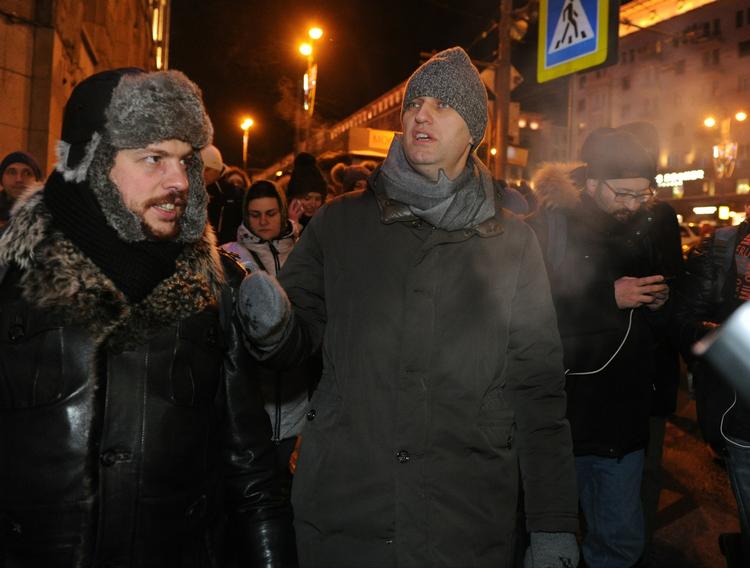 Rusland. Oppositionspolitikeren Aleksej Navalnij, i midten, ses her ved dagens demonstration i Moskva. 