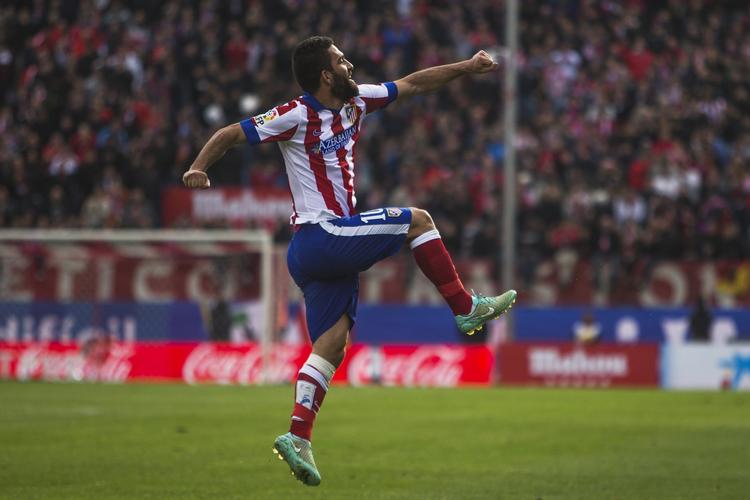 stemme-knas. Arda Turan har som Atletico Madrid-spiller Diego Simeone som træner. 