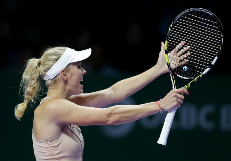 Omsider? Bliver det mon i 2015, Caroline Wozniacki vinder sin første grandslamfinale. Politikens læsere skal spå om, hvor mange finaler tennisstjernen kommer i. 