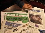 Ytringsfrihed. Det seneste nummer af satiremagasinet Charlie Hebdo til salg i en fransk aviskiosk. Tyriske hjemmesider, der viser forsiden, er blevet blokeret. 