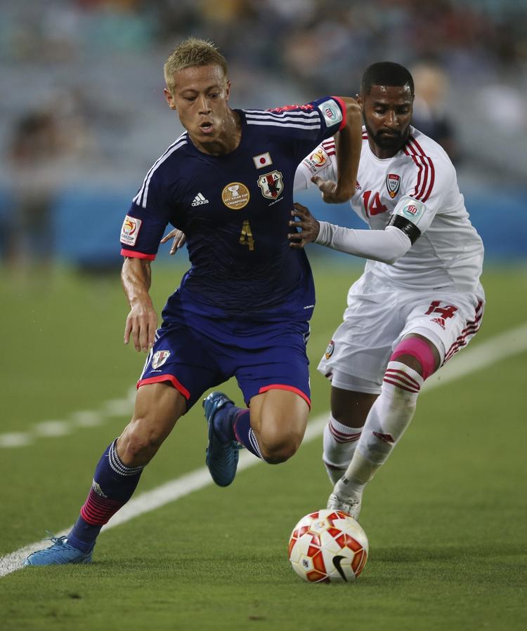 Ude. Keisuke Honda (tv) og Japan er færdige ved Asian Cup, som Japan ellers har vundet fire af de seneste seks udgaver af. 