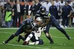 New England Patriots quarterback Tom Brady tackles. 