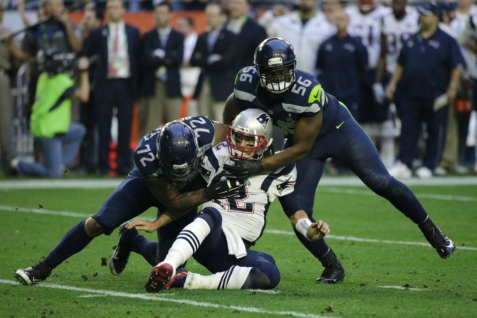 New England Patriots quarterback Tom Brady tackles. 