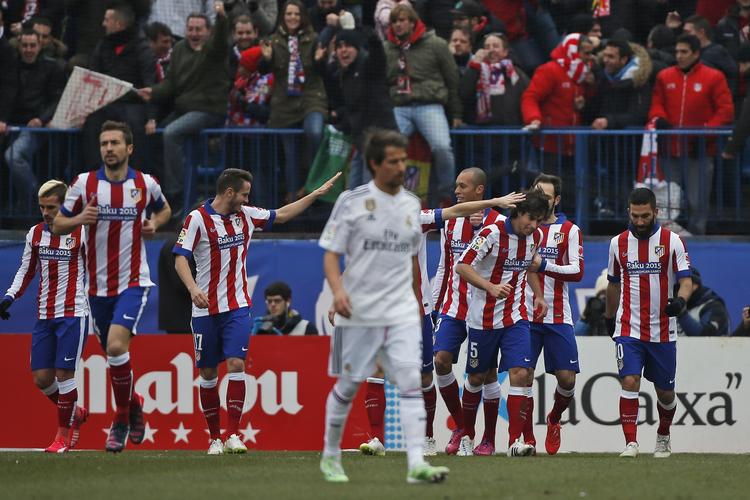 Ydmygelse. Atletico jubler efter Tiagos åbningsmål, der blev efterfulgt af yderligere tre flotte scoringer. 
