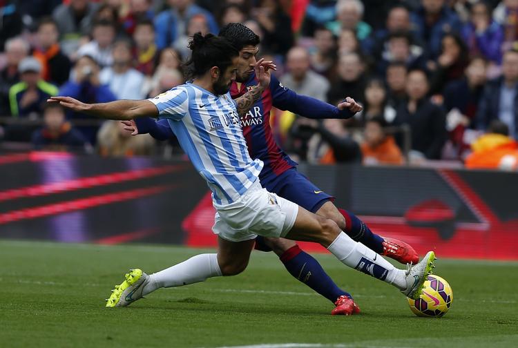 Afbrændere. Luis Suarez (th) samt Lionel  Messi og  Neymar  havde masser af scoringsmuligheder i kampen mod Malaga. Men tabte. 
