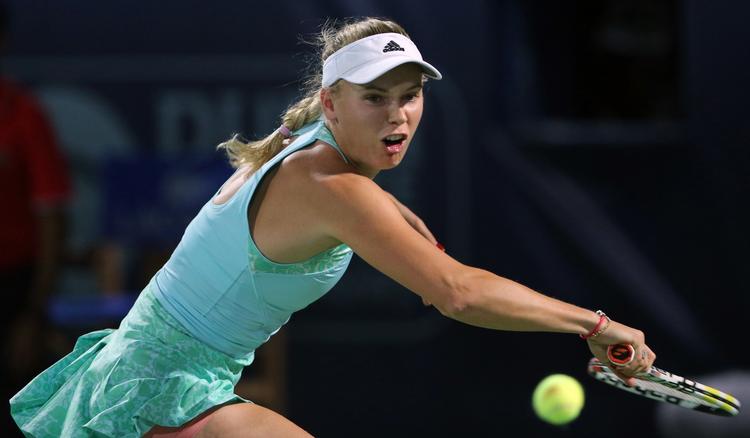 Svært. Caroline Wozniacki kan som konsekvens af Simona Haleps afbud se frem til hård modstand i Qatar 