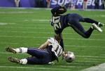Målet. Det er alle footballspilleres drøm, at komme med i en Super Bowl. Her er New England Patriots'  Julian Edelman (11) og  Seattle Seahawks'  Jeremy Lane i kamp om bolden i årets udgave. 