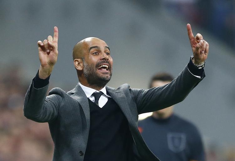 hjem. Josep Guardiola har en lang historie med FC Barcelona først som spiller og siden som træner. 