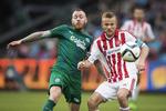 Superliga. OBs Martin Spelmann, tv, og AABs anfører Rasmus Würtz, th. i duel. 