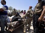 Irak. Islamisk Stat har netop erobret nøglebyen Ramadi. Her ses et arkivfoto af IS-krigere. (Foto: Hadi Mizban/AP) 