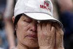 sorg. Kinesiske Wang Run Xiangs søn var om bord på Malaysia Airlines Flight, som forsvandt sidste år. 