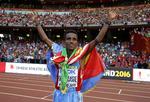 Guld. Ghirmay Ghebreslassie fejrer vm-guld efter sit kun tredje maraton. 