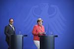MIGRATIONSMØDE. Francois Hollande og Angela Merkel vil have en fælles EU-kurs i behandlingen af de mange flygtninge og migranter, der søger mod Europa. 