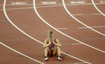 skuffelse. Sara Slott på banen i Beijing efter finalen på 400 meter hæk. 
