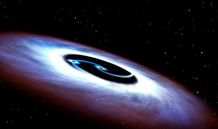 SAMMENSMELTNING. Sådan kan det ifølge en illustration fra Nasa tage sig ud, når Mrk 231's indre er støvsuget for stof af de to sorte huller, der i sidste ende vil blive ét. I 